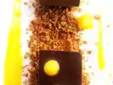 Recette Une gelée de chocolat noir-pannacotta cardamome, et coulis de mangue..