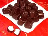 Recette Pralines au chocolat noir fourrées à la crème fraîche framboises