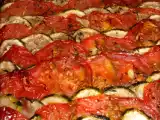 Recette Tian de courgettes et tomates sur lit d'oignons confits